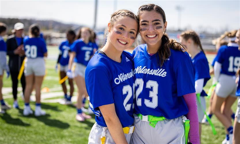 Girls play flag football